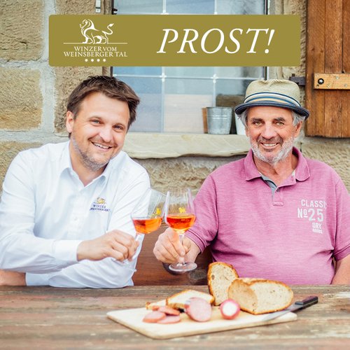Two men having a toast with a glass of Winzer vom Weinsberger Tal wine